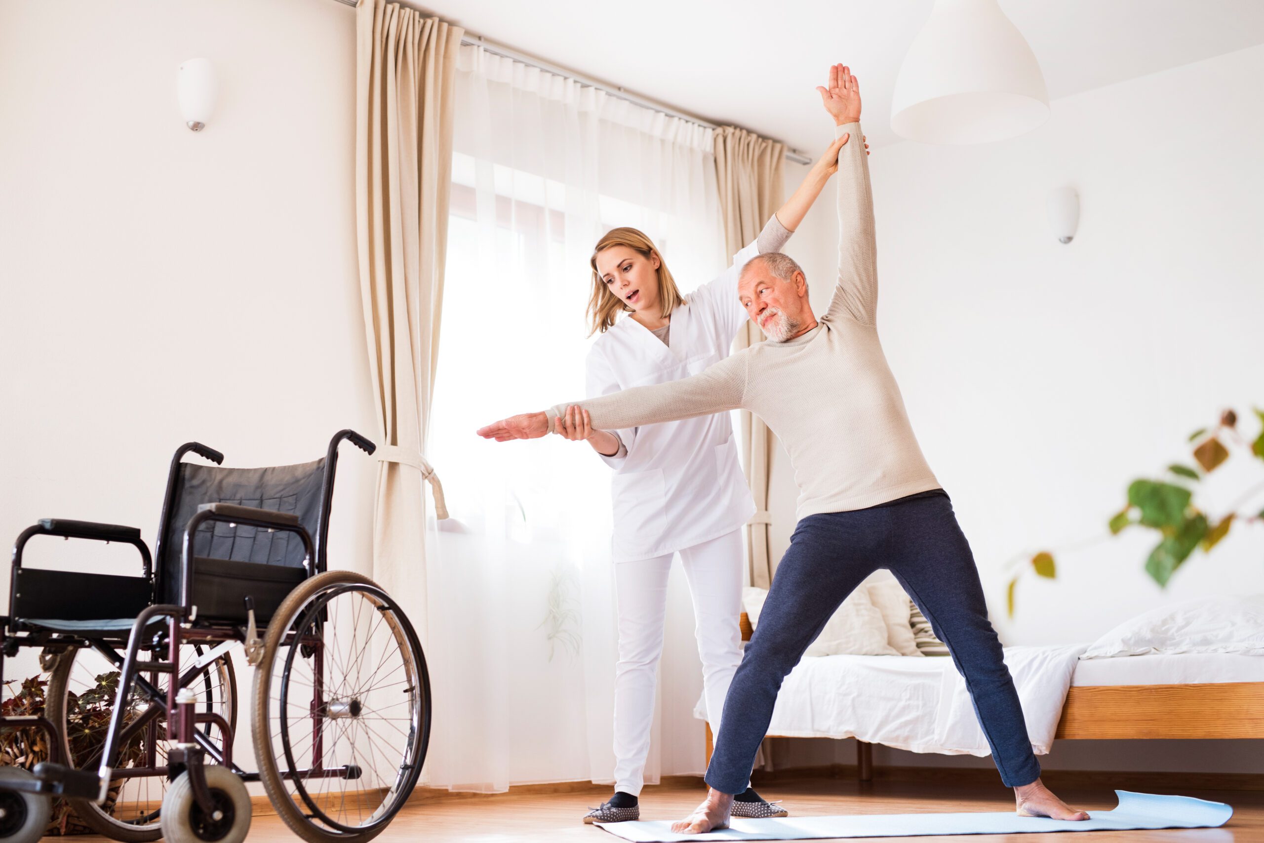 health visitor and senior man during home visit 2022 02 02 05 06 57 utc scaled